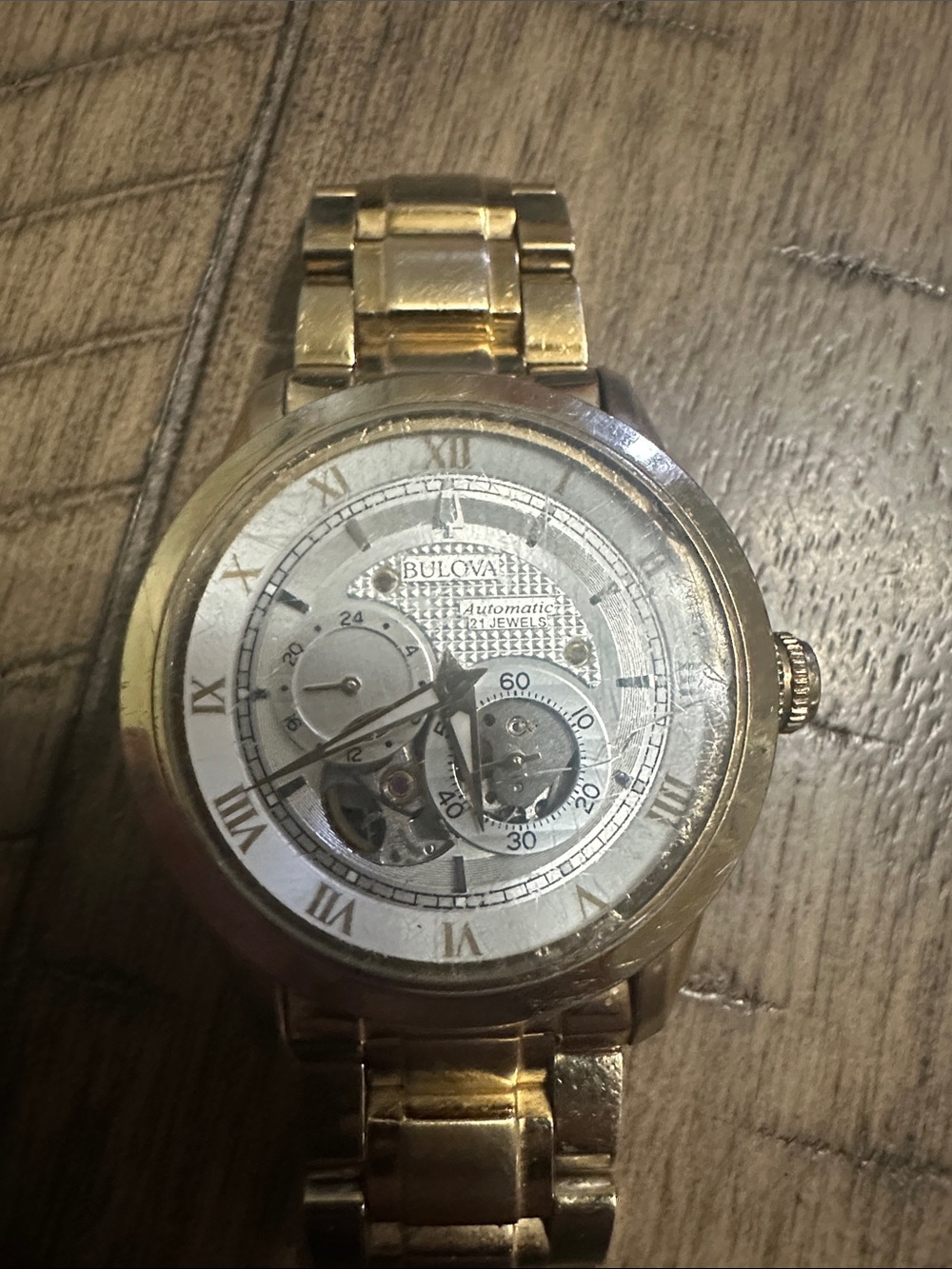 Bulova Gold-Tone Men's Skeleton Dial Watch with Silver Face